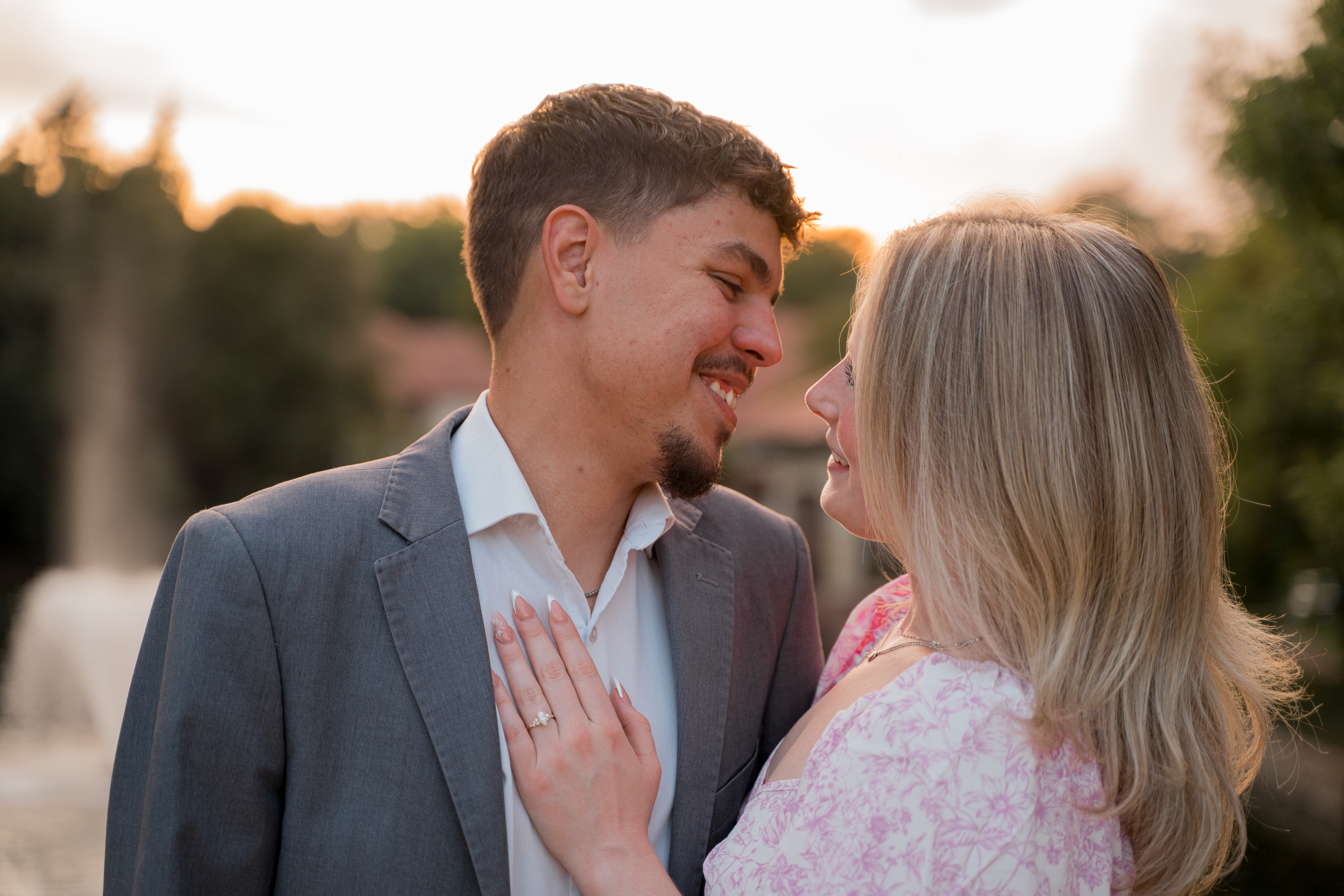 Eli and Shailyn at sunset, smiling at each other
